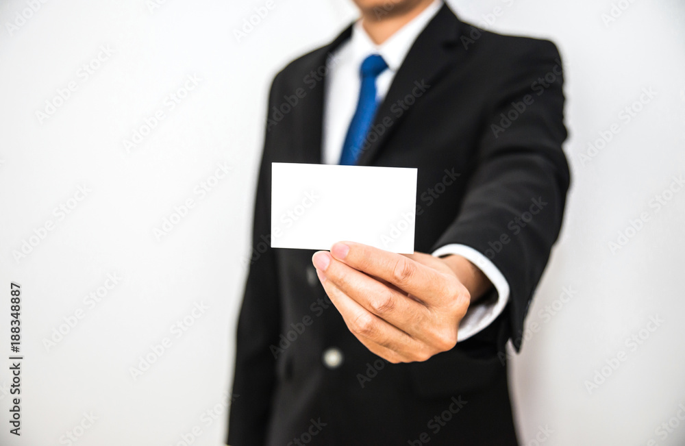 Business man hold white name card paper on hand with isolated white background Business man hold white name card paper on hand with isolated white background