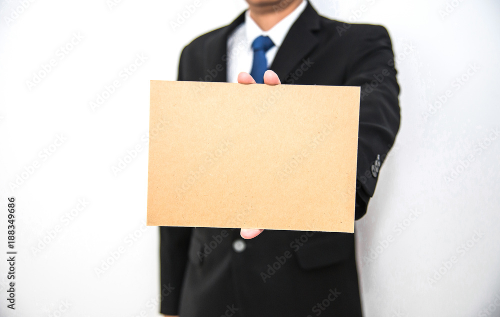Business man hold blank cartboard paper on hand with isolated white background Business man hold blank cartboard paper on hand with isolated white background