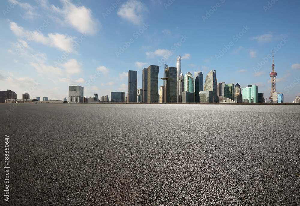 Empty road surface floor with city landmark buildings of Shanghai Skyline Empty road surface floor with city landmark buildings of Shanghai Skyline