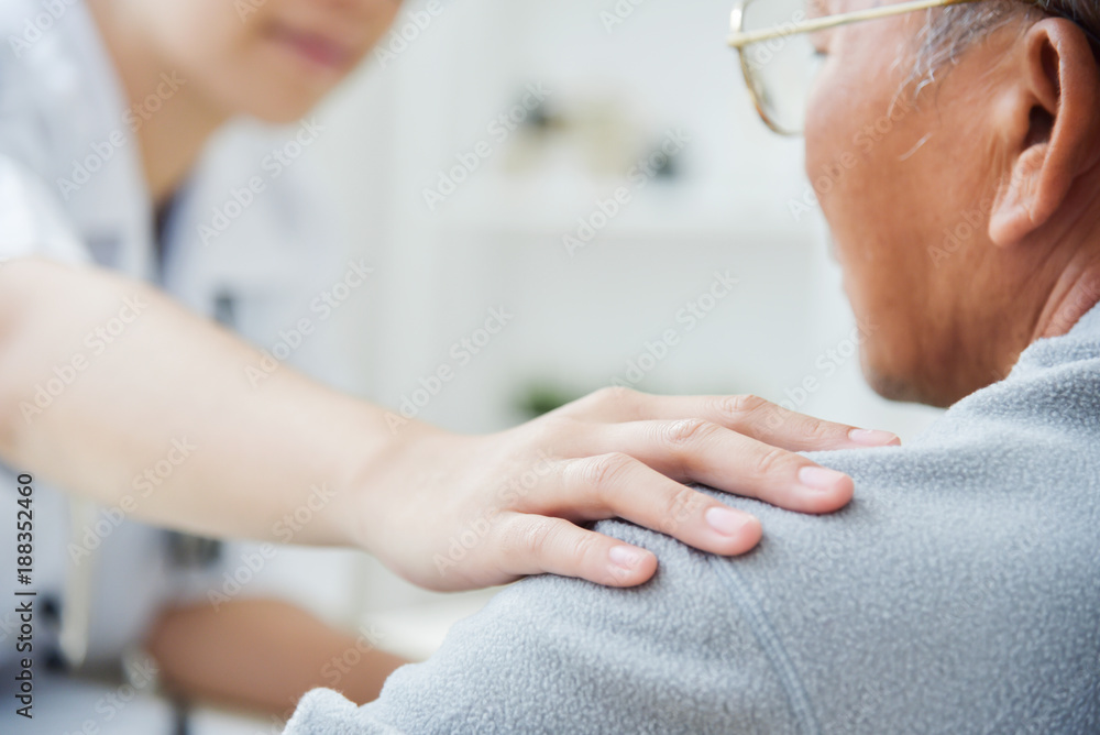 Female doctor comforting senior male patient. Female doctor comforting senior male patient.