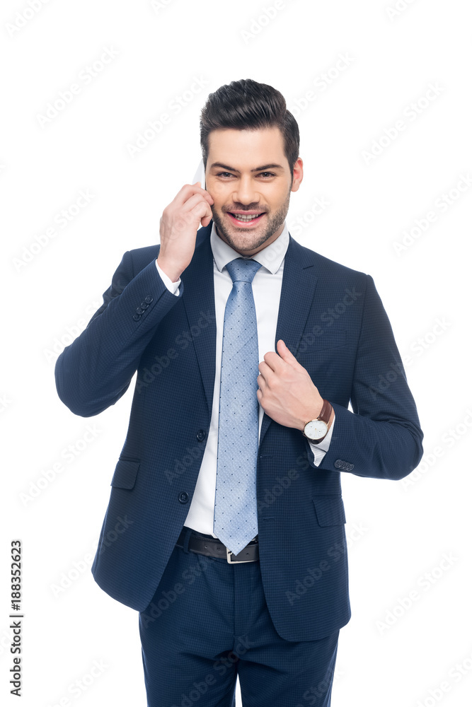 handsome smiling businessman in suit talking on smartphone, isolated on white handsome smiling businessman in suit talking on smartphone, isolated on white