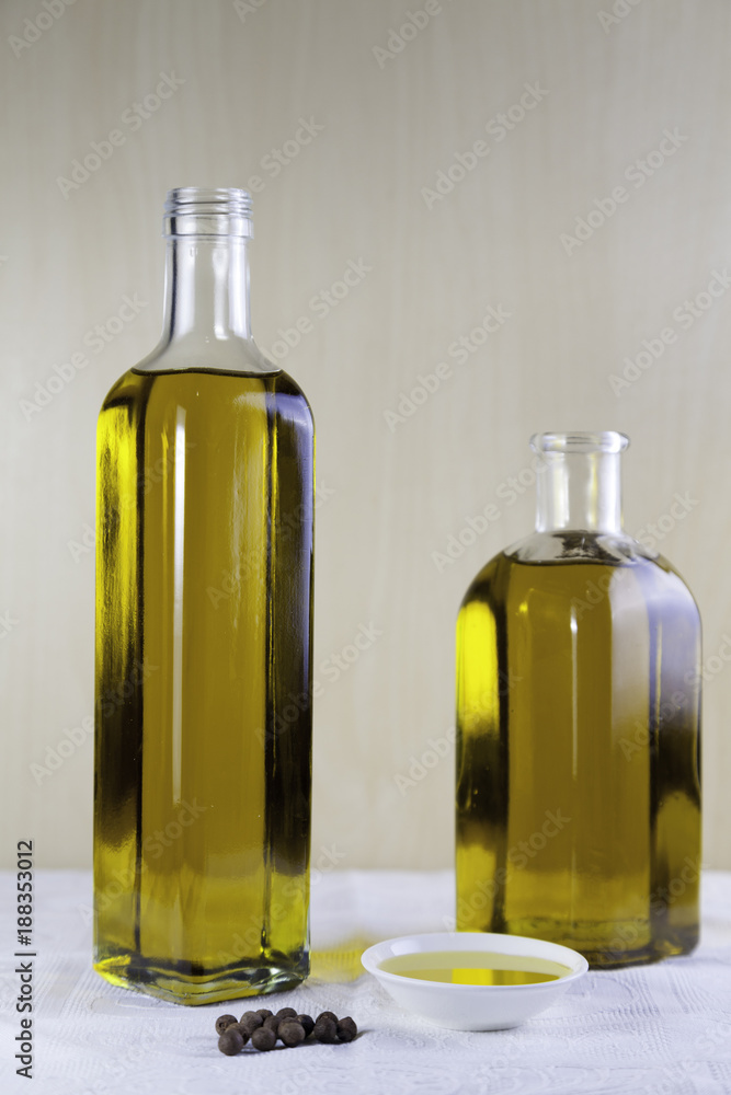 Two bottle olive oil with a test plate
