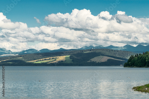 Orava reservoir with mountains in the background