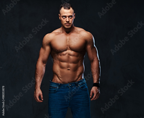 Portrait of shirtless muscular male in a jeans. © Fxquadro