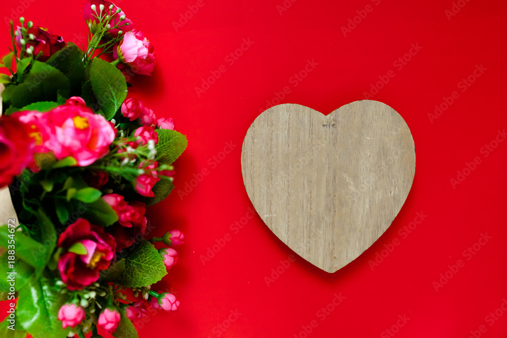 Valentine's day gift for the second half, a bouquet of flowers, a romantic photo, a wooden heart on a red background, background suitable for advertisement , insert text Valentine's day gift for the second half, a bouquet of flowers, a romantic photo, a wooden heart on a red background, background suitable for advertisement , insert text