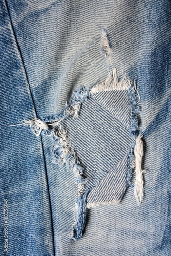 Blue denim jean Ripped Destroyed with seam texture and background