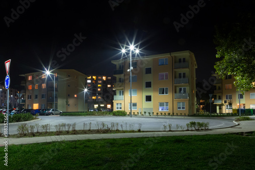 Fototapeta Naklejka Na Ścianę i Meble -  small roundabout in residential quarter at night with modern  streetlights