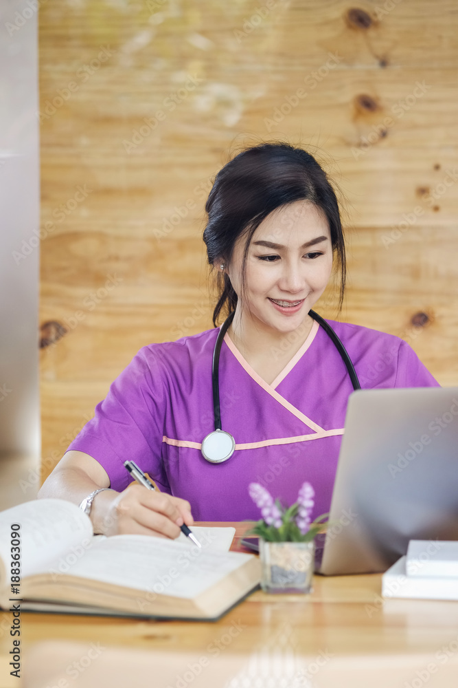 Portrait of Asian woman doctorate education working by laptop in medical school. Portrait of Asian woman doctorate education working by laptop in medical school.