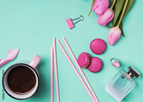 Womans accessories, coffee and pink tulips.