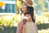 Beautiful young woman with shopping bags