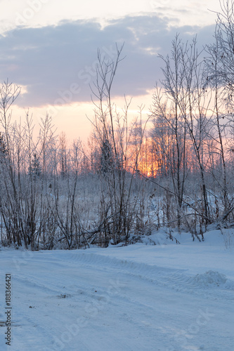 Sunset over the winter road © ads861