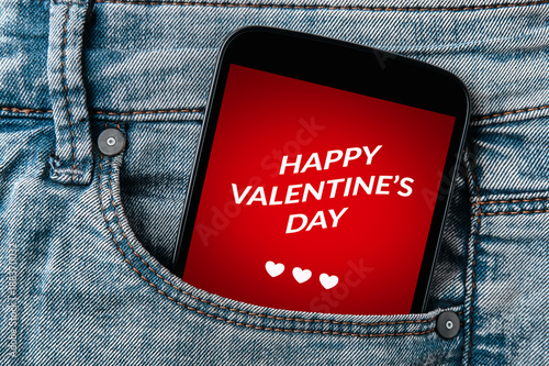Valentine's day concept on smartphone screen in jeans pocket. All screen content is designed by me. 