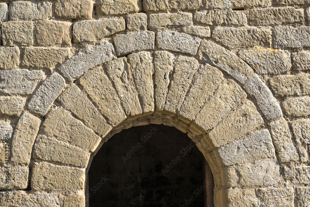 semicircular arch at the entrance of a small chapel Romanesque architecture style. half-point arch