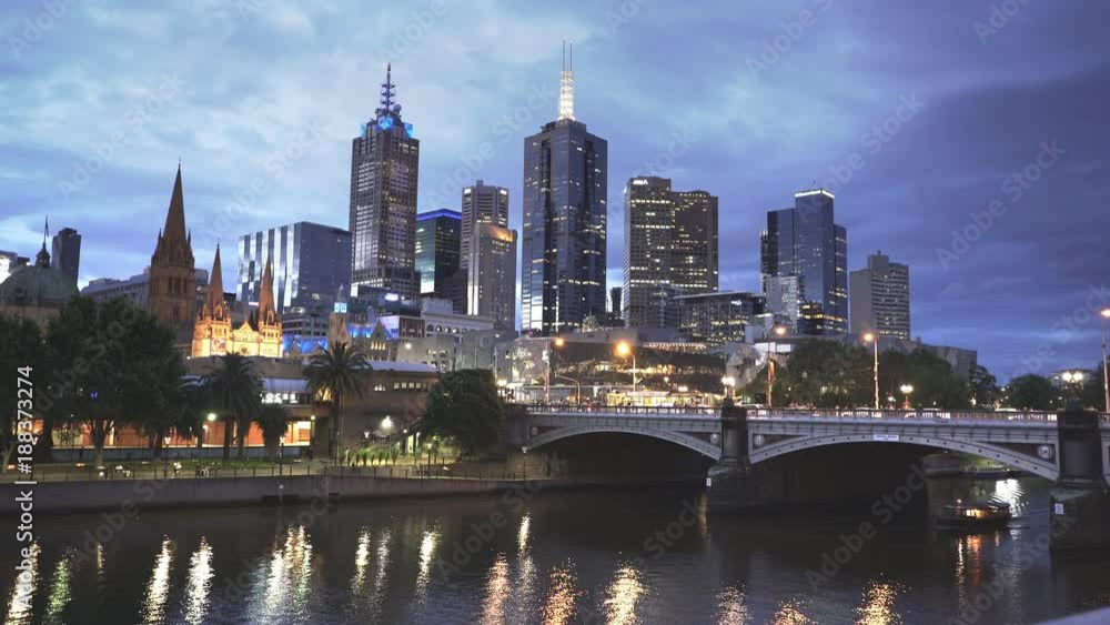 night shot of a ferry passing under a bridge on melbourne's yarra river in the australian state of victoria night shot of a ferry passing under a bridge on melbourne's yarra river in the australian state of victoria