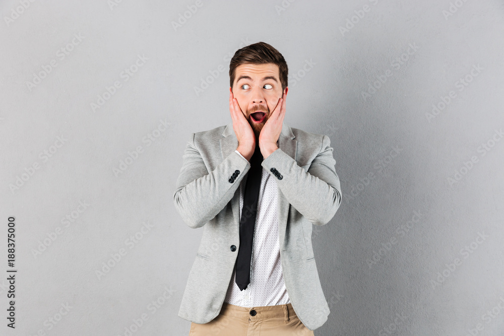 Portrait of a surprised businessman dressed in suit Portrait of a surprised businessman dressed in suit