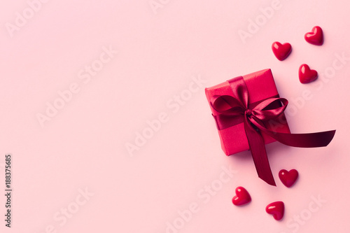 Red gift box on pink background