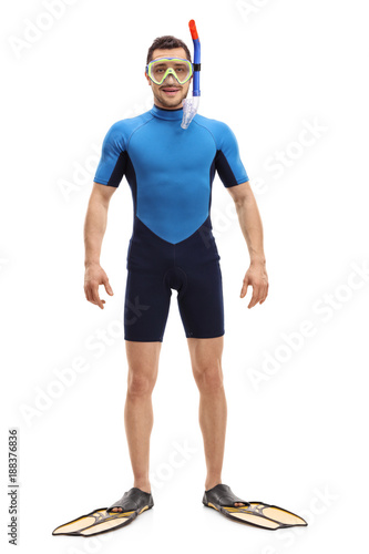 Man in a wetsuit with snorkeling equipment