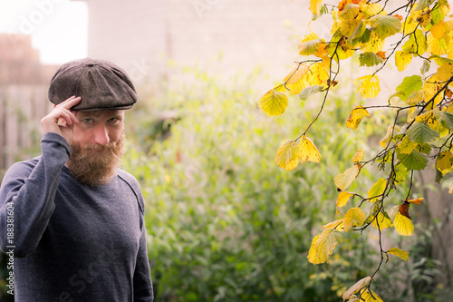 Vintage style in autumn - man with beard and flat cap