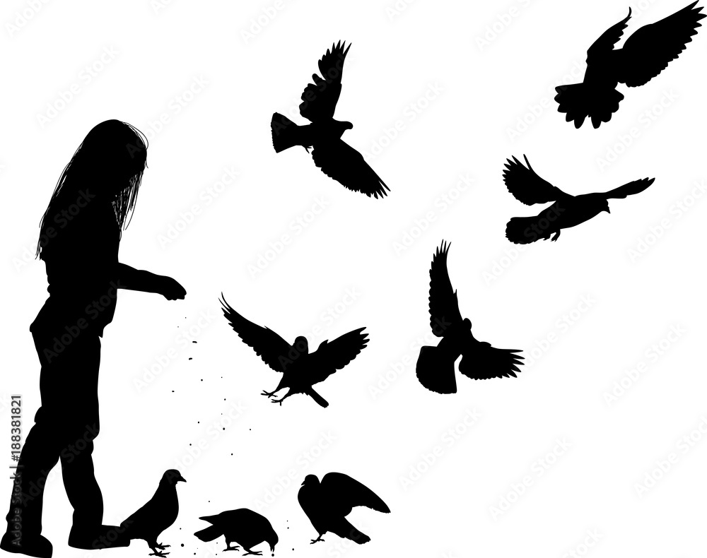 Obraz premium girl feeding doves isolated on white