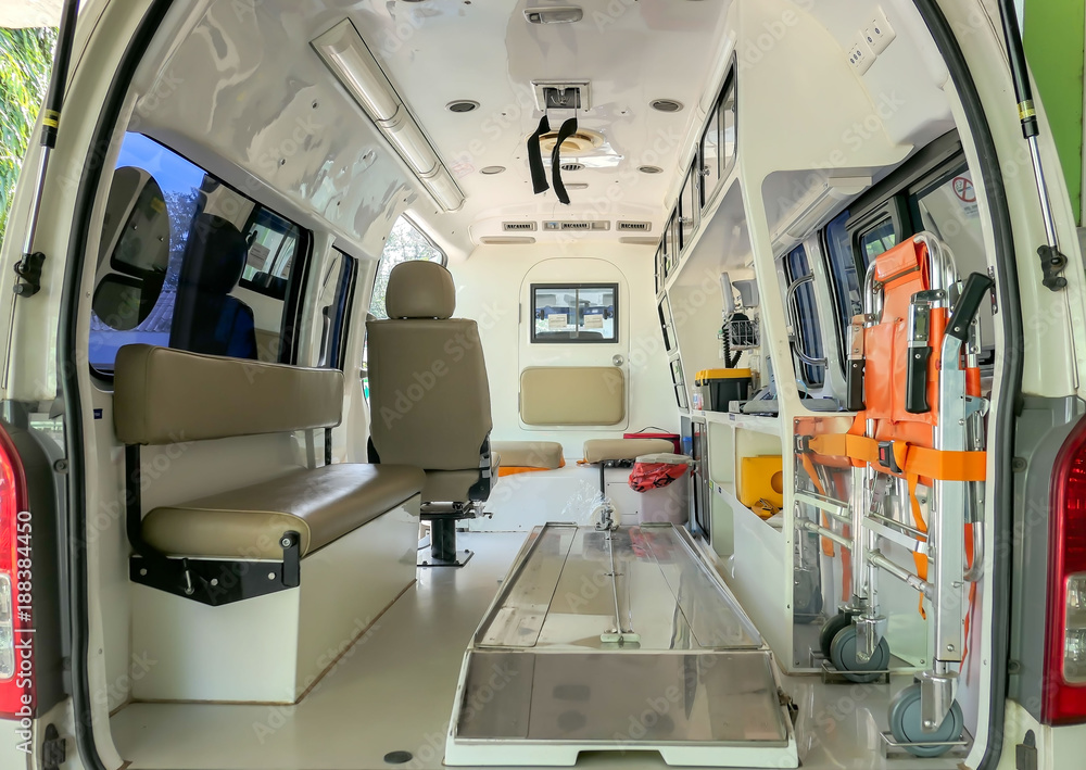 Inside an ambulance with medical equipment . Car for patient refer .
