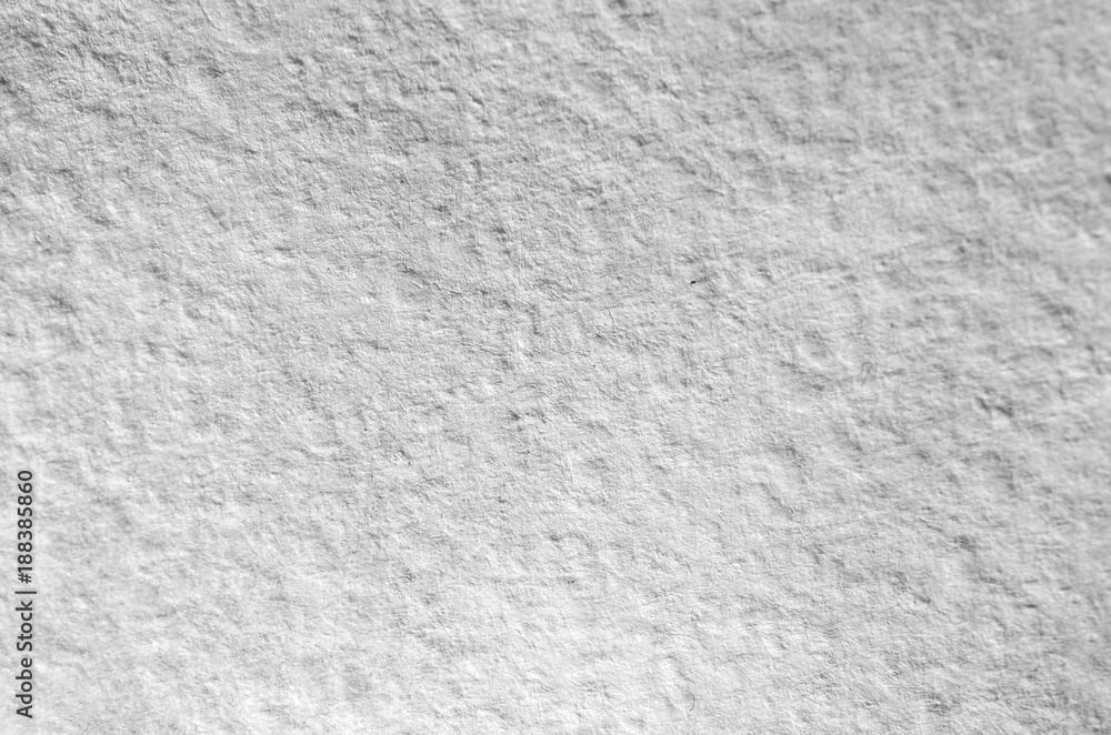 Obraz premium Texture of thick paper intended for watercolor painting. Macro snapshot of details of the relief paper structure