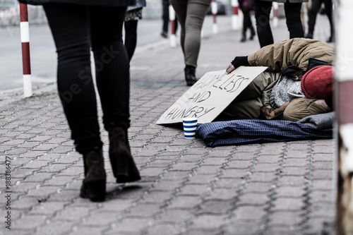 Dirty person on the sidewalk