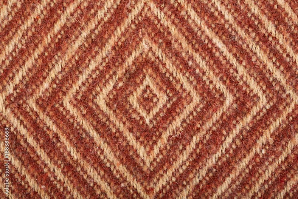 Woolen fabric close-up. Fabric in a geometric pattern.