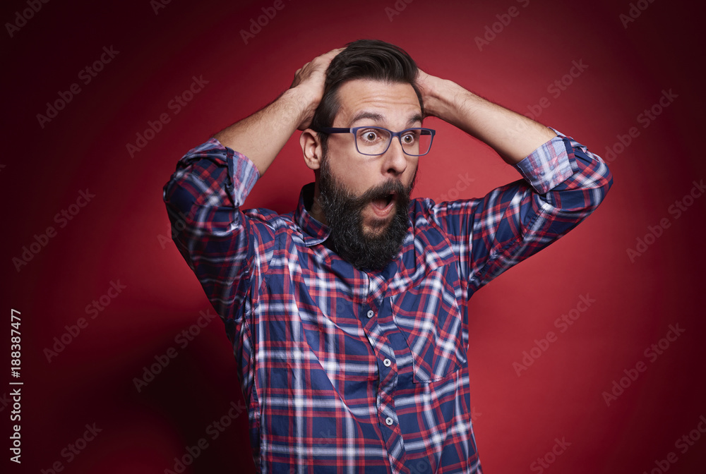 Shocked man shouting at studio shot . Shocked man shouting at studio shot .