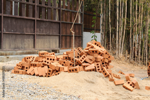 Orang brick pile in construction site.