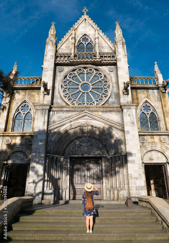 Fototapeta premium Tourist is watching old church in Danang, Vietnam