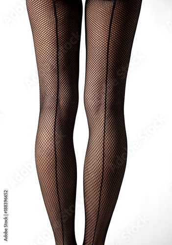 lose-up of legs with fishnet stockings and back line