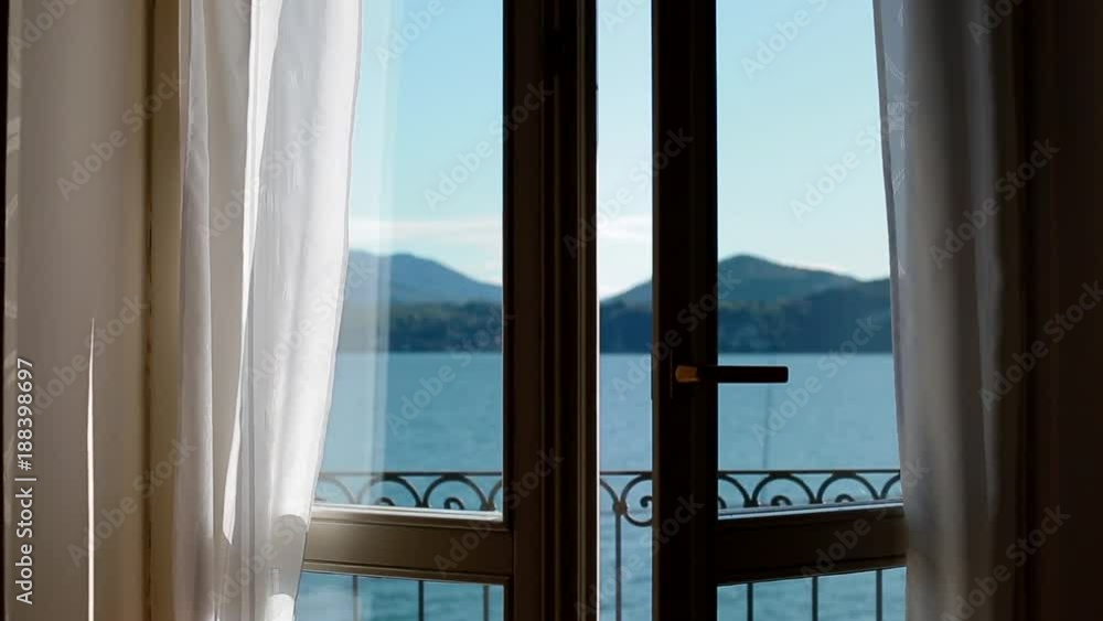 View of Lago Maggiore through opening window. Chamber influx. View of Lago Maggiore through opening window. Chamber influx.