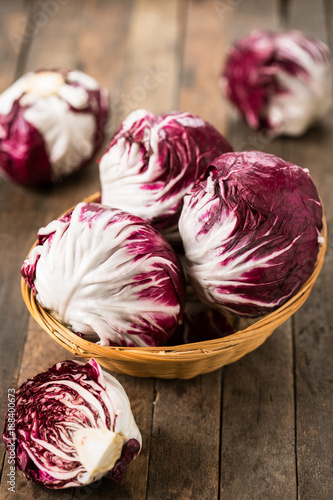 Photos Red organic radicchio in the basket