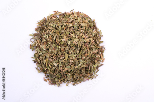 Pile of dry oregano spice. Top view of a portion herbs seasoning isolated on a white background.