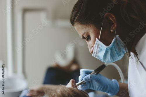 Dentist at work with patient