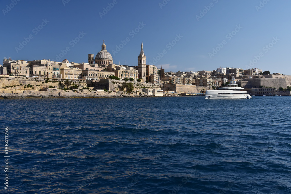 Maltese capital Valletta seen from the see. Serene afternoon in the bay of Sliema