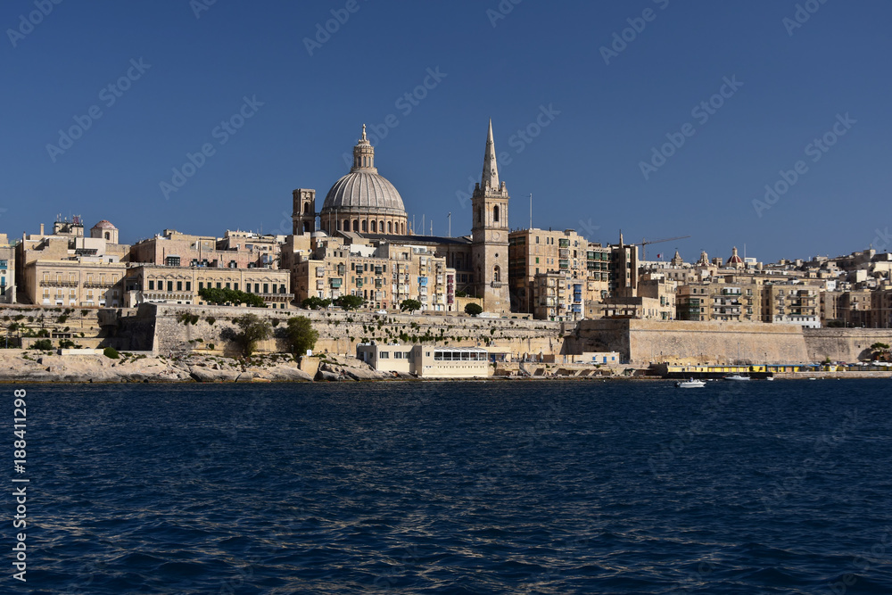 Maltese capital Valletta seen from the see. Serene afternoon in the bay of Sliema