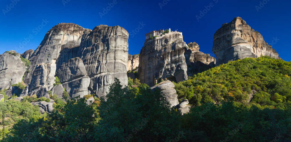 Panoramas of monasteries in Greece in the mountains of Meteora. Mountain View. Tourist places in Greece. Orthodox monasteries on top of the Meteora Mountains. Panoramas of monasteries in Greece in the mountains of Meteora. Mountain View. Tourist places in Greece. Orthodox monasteries on top of the Meteora Mountains.