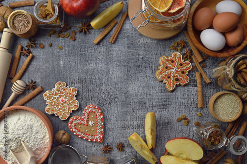 A plurality of spices and cooking utensils. Natural products. Food background. Top view. Rural style.