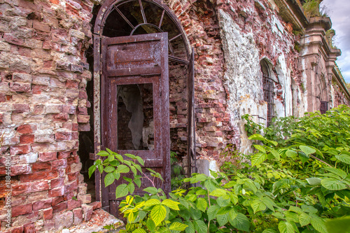 The building is overgrown w...