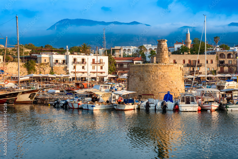Scenic view of Kyrenia (Girne) harbour with mountains on background. Cyprus