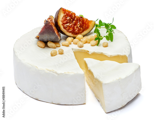 Foto Round brie or camambert cheese on a white background