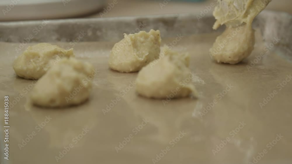Fresh dough scooped dough on pan, close up Fresh dough scooped dough on pan, close up