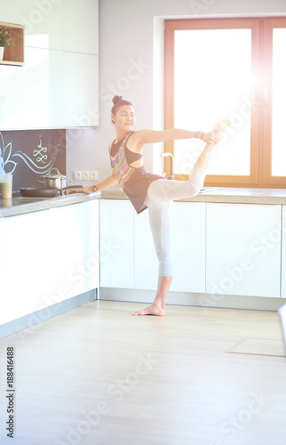 Fitness girl cooking healthy food in the kitchen. Woman. Kitchen. Cooking