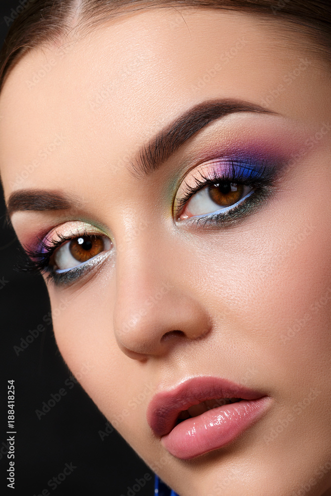 Fototapeta premium Portrait of beautiful woman with fashion makeup