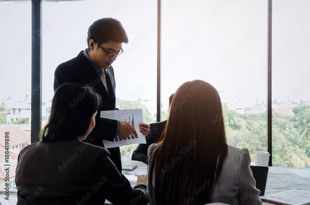 asian project manager showing and presenting growth chart diagram of financial report or results of the year in meeting room at office, investment, company success, and teamwork concept, vintage tone asian project manager showing and presenting growth chart diagram of financial report or results of the year in meeting room at office, investment, company success, and teamwork concept, vintage tone