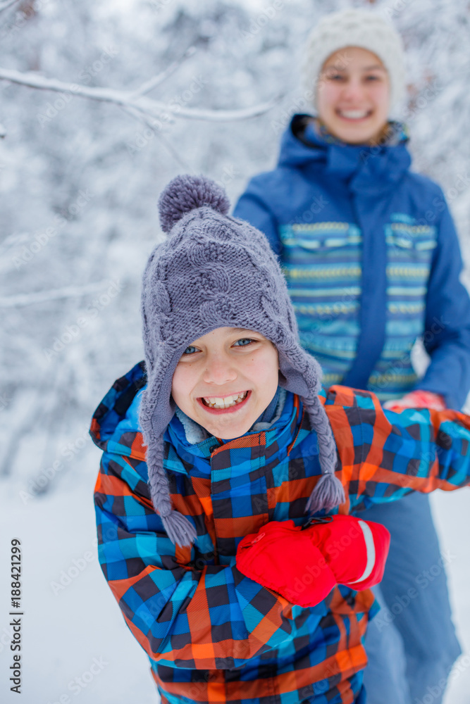 Happy children playing on snowy winter day. Happy children playing on snowy winter day.