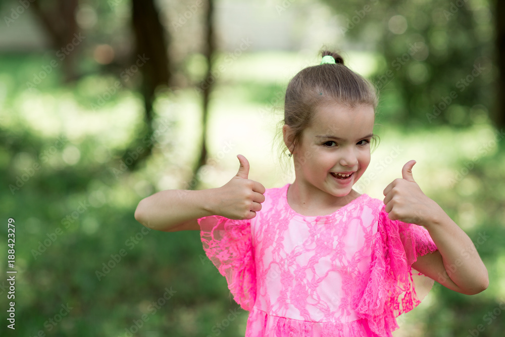 Caucasian girl posing on camera showing approving sign with hands Caucasian girl posing on camera showing approving sign with hands