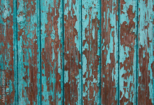 .Texture of vintage turquoise painted wooden background with layers of paint