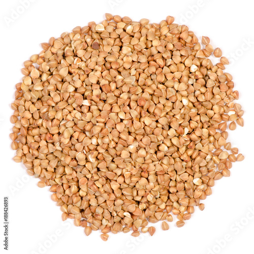Pile of buckwheat groats on a white background